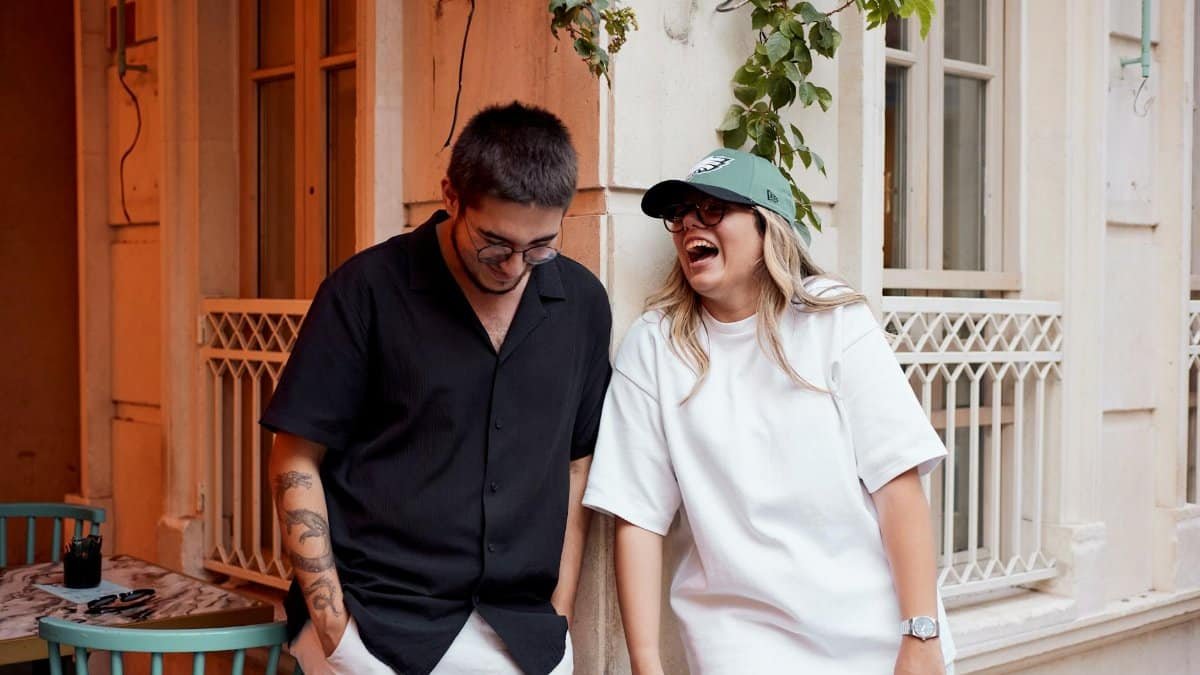 Two friends share a lighthearted moment outdoors in Istanbul, capturing the spirit of friendship and joy.