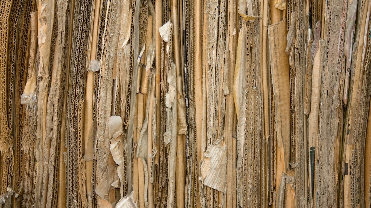 Detailed view of stacked recyclable cardboard showing texture and patterns.