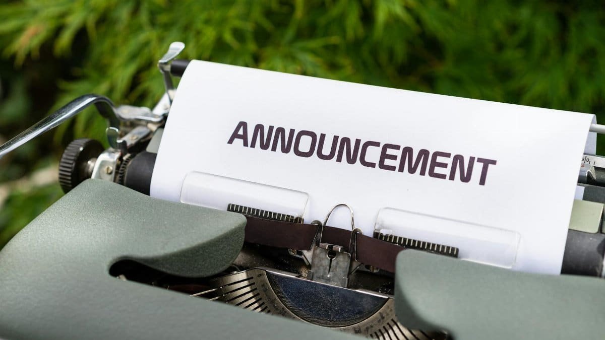 Close-up of a paper labeled 'Announcement' in a typewriter outdoors.