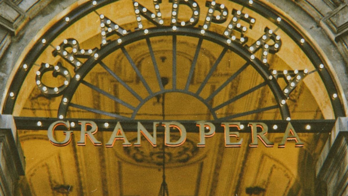 Close-up of the illuminated entrance sign of Grand Pera, a notable landmark in Istanbul, Turkey.