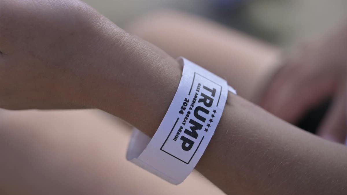 A close-up of a wristband showing political support for 'TRUMP 2024.'