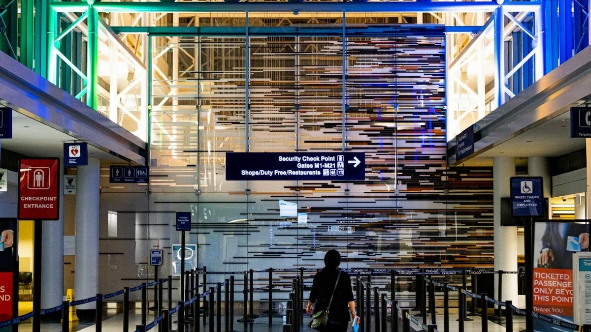 A traveler enters the security checkpoint at O'Hare Airport terminal, Chicago.