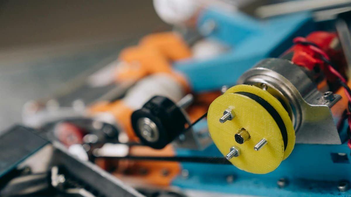 Detailed view of machine gears and components, focusing on engineering elements.