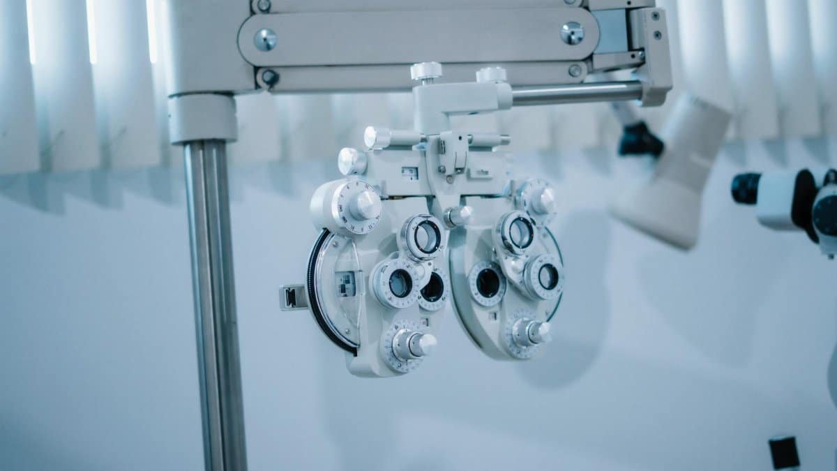 Detailed view of an optical phoropter in a modern eye clinic, used for testing vision clarity.
