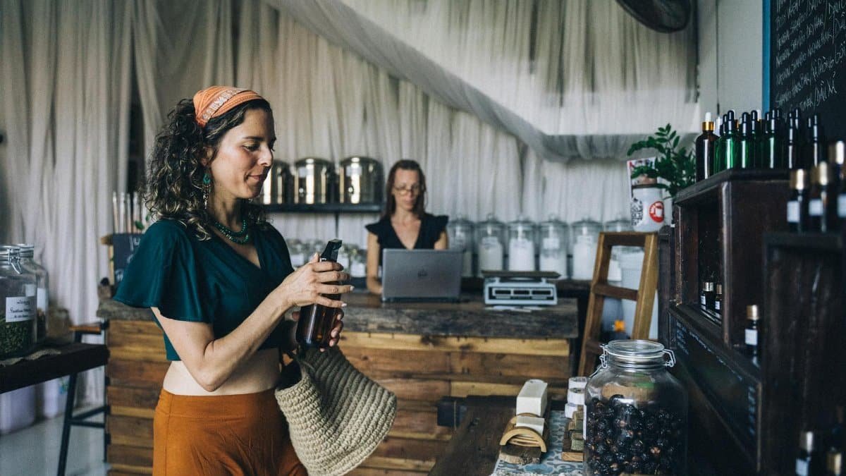 Woman shopping for organic products in eco-friendly store with rustic decor.