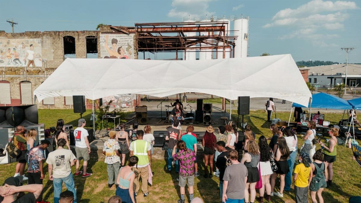 Outdoor concert with diverse crowd enjoying live music in Chattanooga, Tennessee.