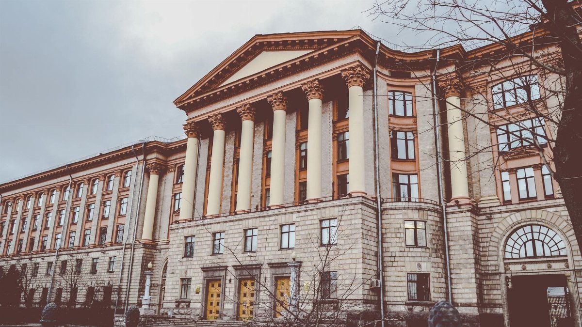 Neoclassical building with tall columns, showcasing architectural elegance.