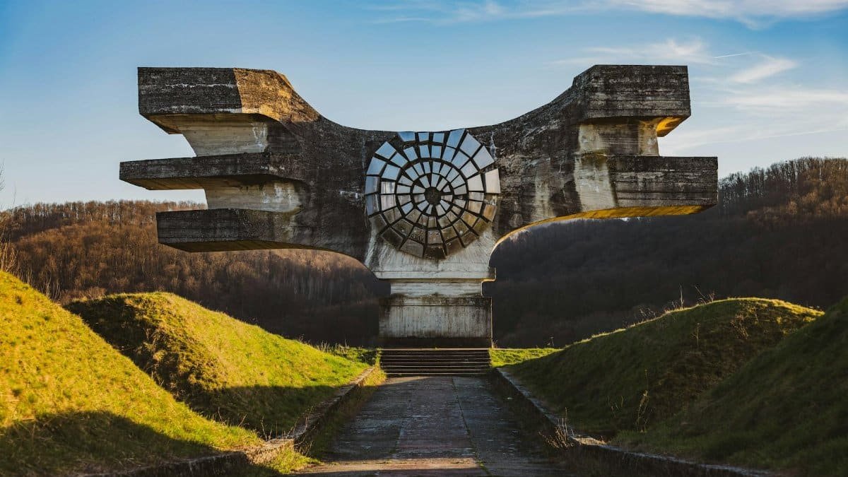 The Monument to the Revolution in Podgarić, Croatia, against a picturesque outdoor backdrop.