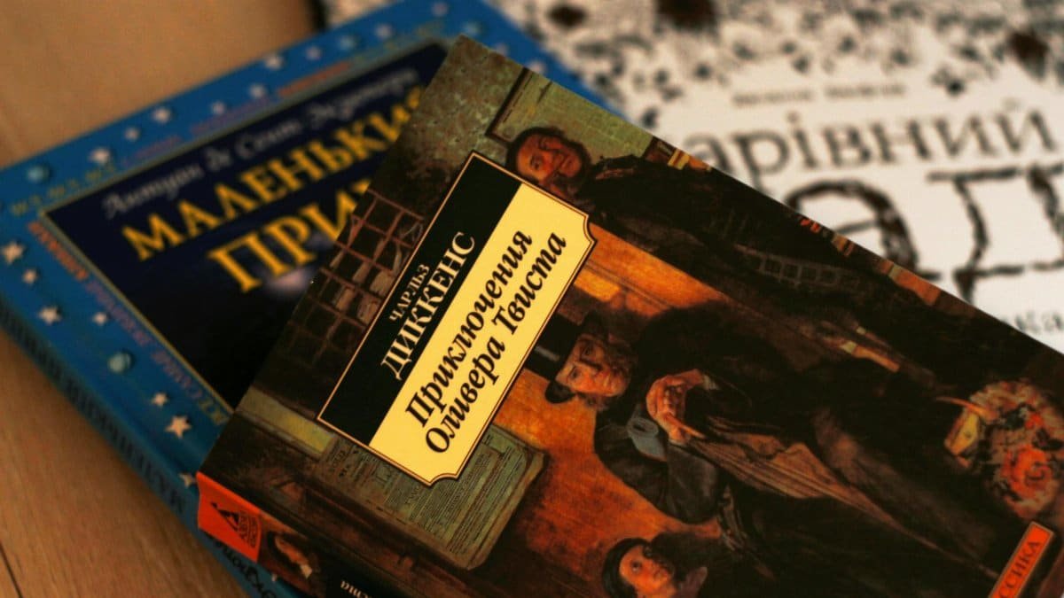 Close-up of Ukrainian versions of classic literature, including 'Oliver Twist' by Charles Dickens.