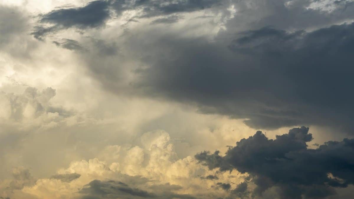 Vivid image of large dark and light clouds in a stormy sky, capturing dynamic weather.