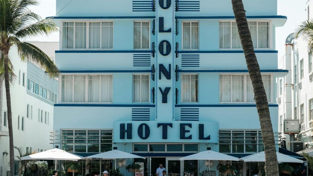 Colony Hotel in Miami Beach, iconic Art Deco architecture with classic cars.