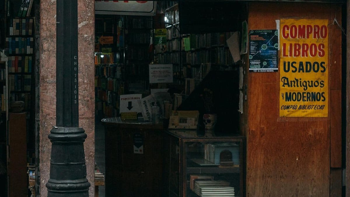An inviting bookstore entrance displaying a vibrant sign in Mexico City, CDMX, Mexico.