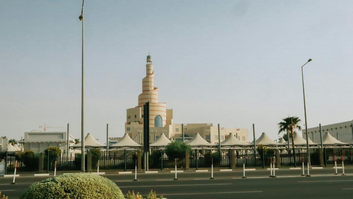 The iconic Fanar Mosque in Doha, Qatar, stands majestically under a clear blue sky.
