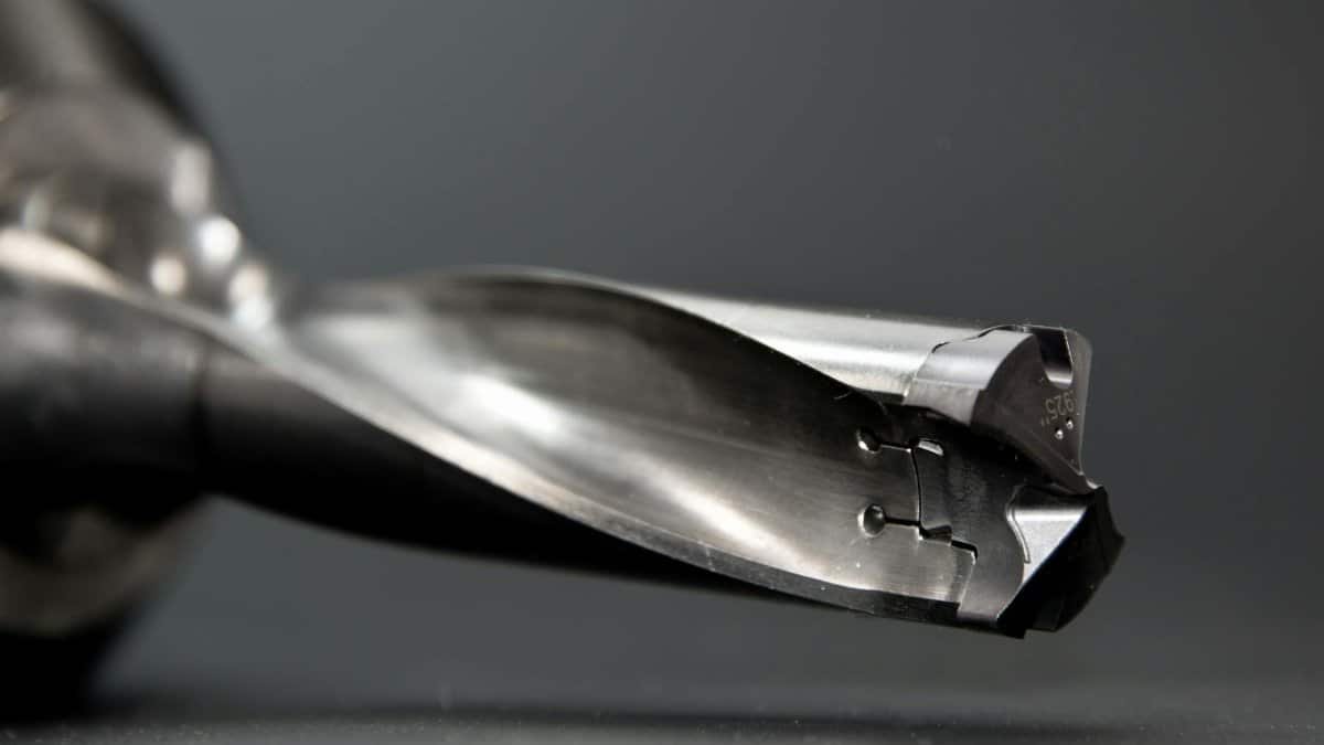 Detailed view of a sharp stainless steel drill bit, ideal for industrial use.