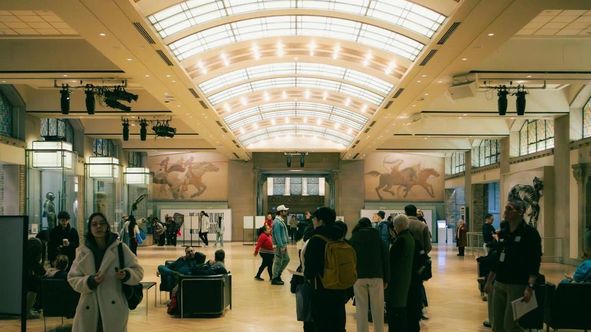 People exploring an art museum exhibit in Toronto, Ontario, Canada.