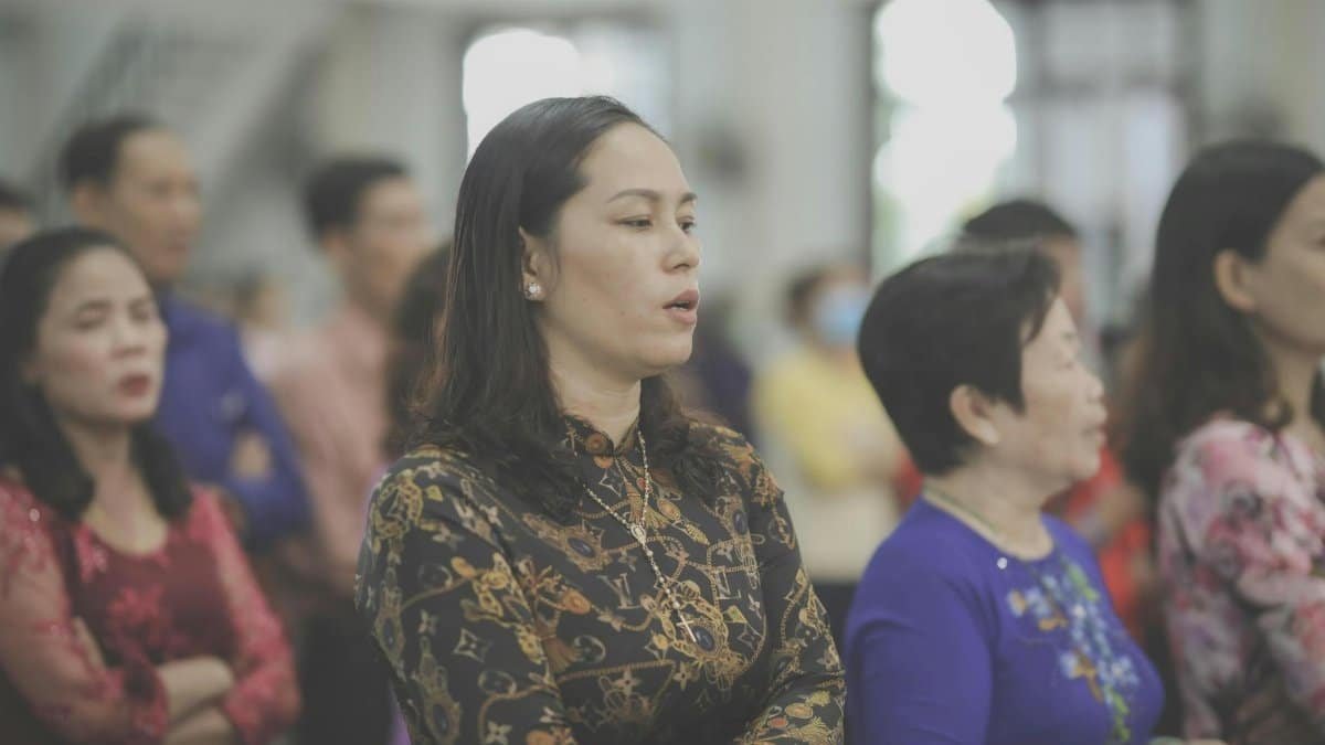 A group of people attentively participating in a church service, embodying community and faith.