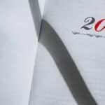 Close-up of an open planner showing the year 2021 with minimalist styling and shadows.