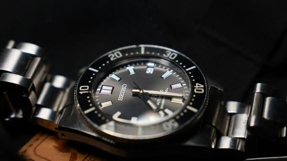 Close-up shot of a Seiko diver watch with a metal strap, emphasizing its design and craftsmanship.