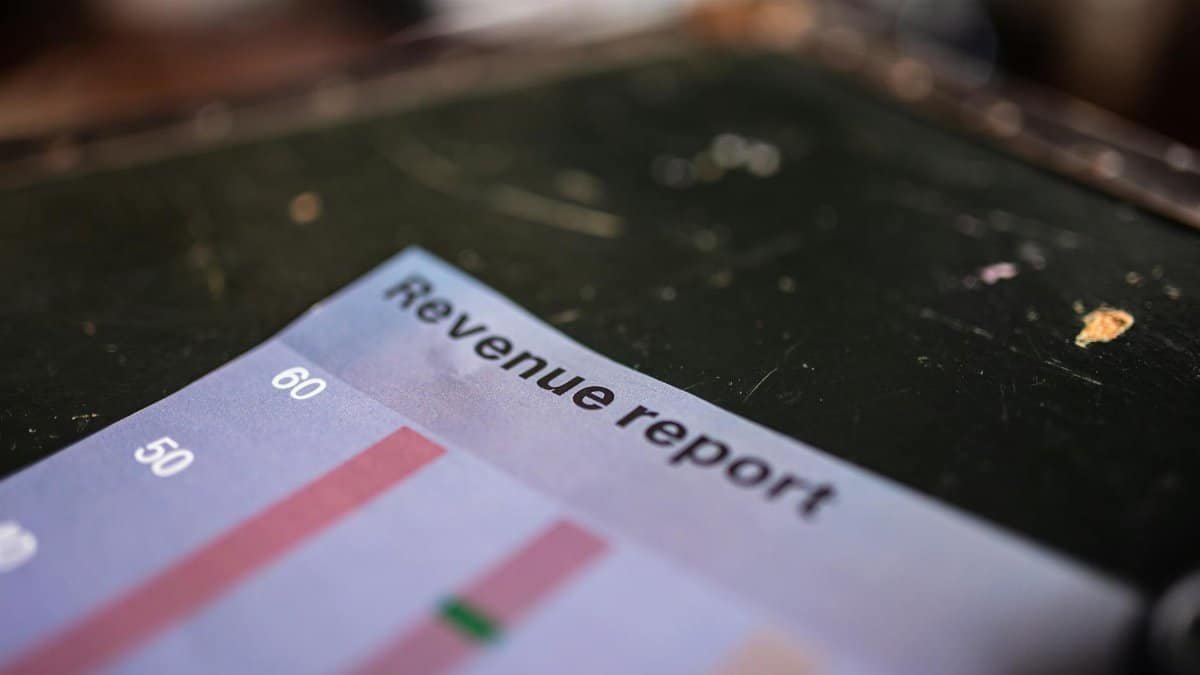 Detailed view of a revenue report featuring a bar chart in an office setting.