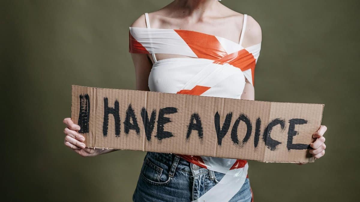 A protest scene emphasizing human rights and empowerment with a bold 'I Have a Voice' sign.