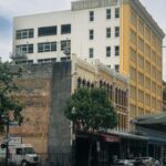Scenic view of historic buildings in downtown Houston, showcasing urban architecture on a sunny day.