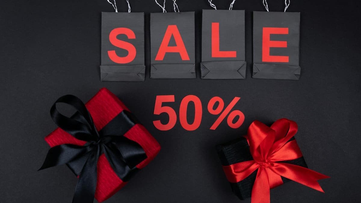 Stylish sale promotion with black and red gift boxes and shopping bags, perfect for holiday discounts.