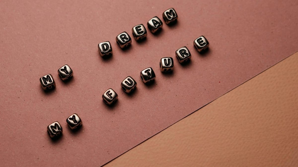 Beaded block letters spelling 'My Dream My Future' on a textured pink background.