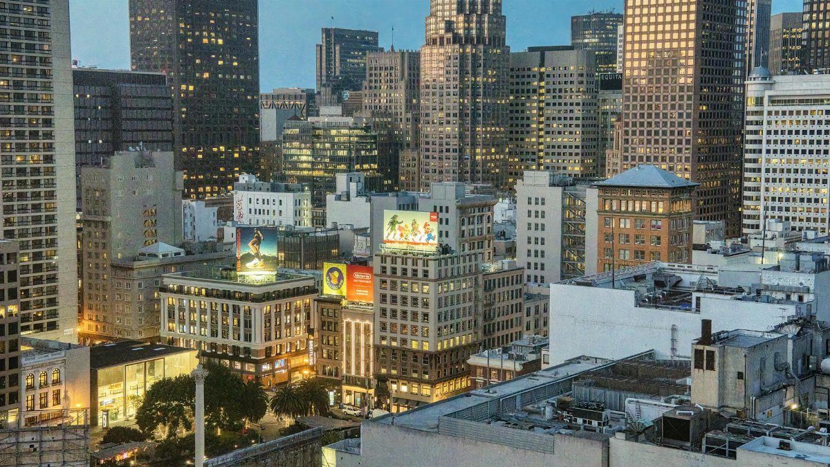 Twilight view of San Francisco skyline featuring iconic architecture and bustling city life.