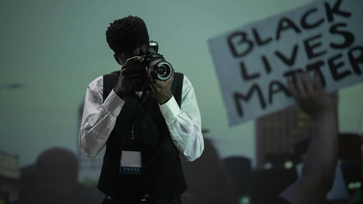 A photojournalist capturing a pivotal moment at a Black Lives Matter protest.