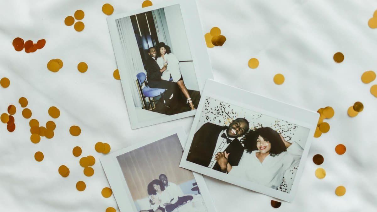 Polaroid pictures of a happy couple surrounded by confetti, capturing cherished moments.