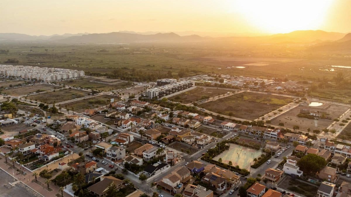 Scenic aerial view of Casablanca, Spain with sprawling townscape and serene sunset sky.