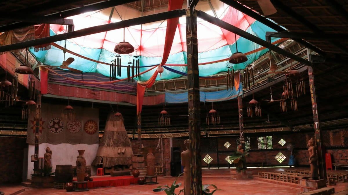 Explore a rustic interior featuring traditional decor and colorful textiles in a cultural setting.