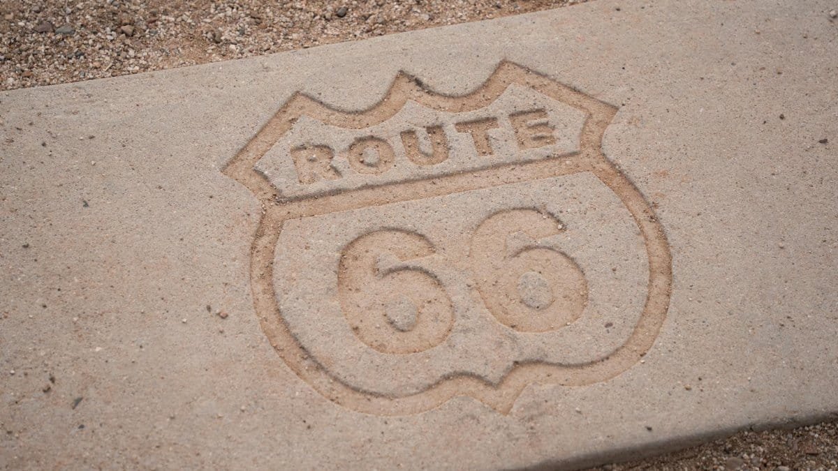 Route 66 emblem etched in concrete at Petrified Forest National Park, Arizona, USA.