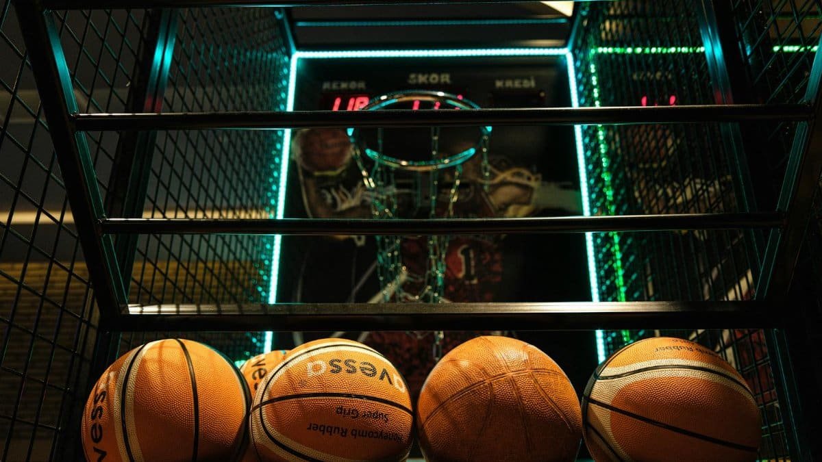 Close-up view of basketballs lined up for an arcade basketball hoop game.