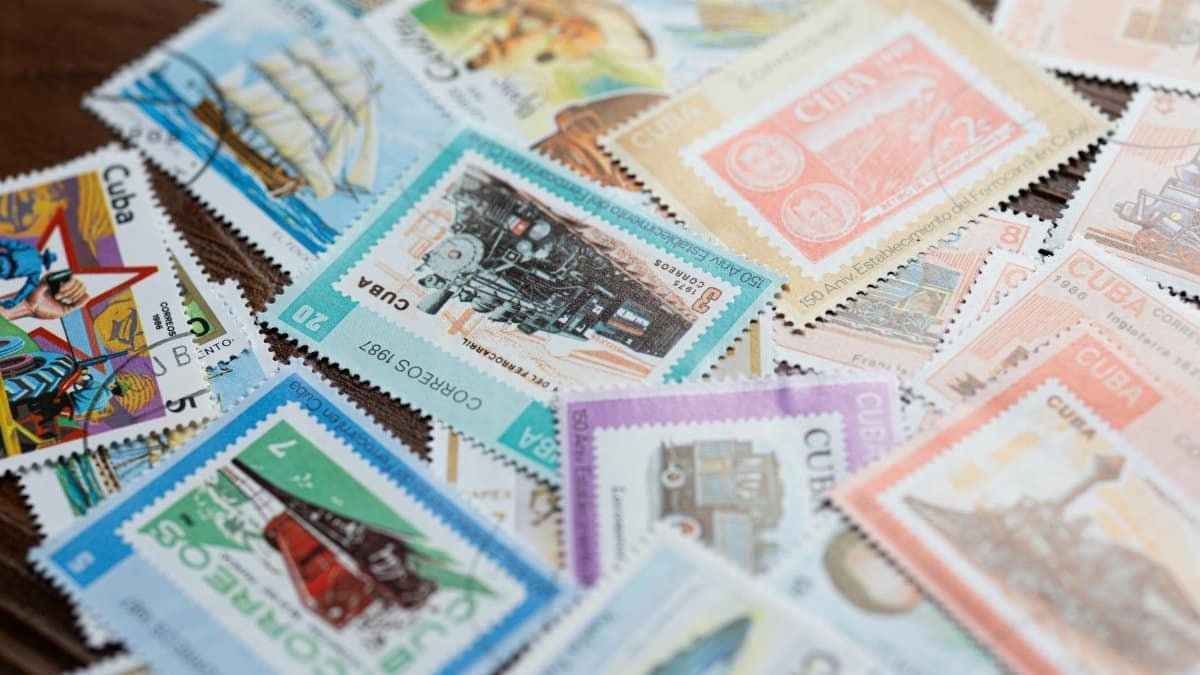 An artistic display of colorful vintage Cuban postage stamps showcasing various themes and designs.