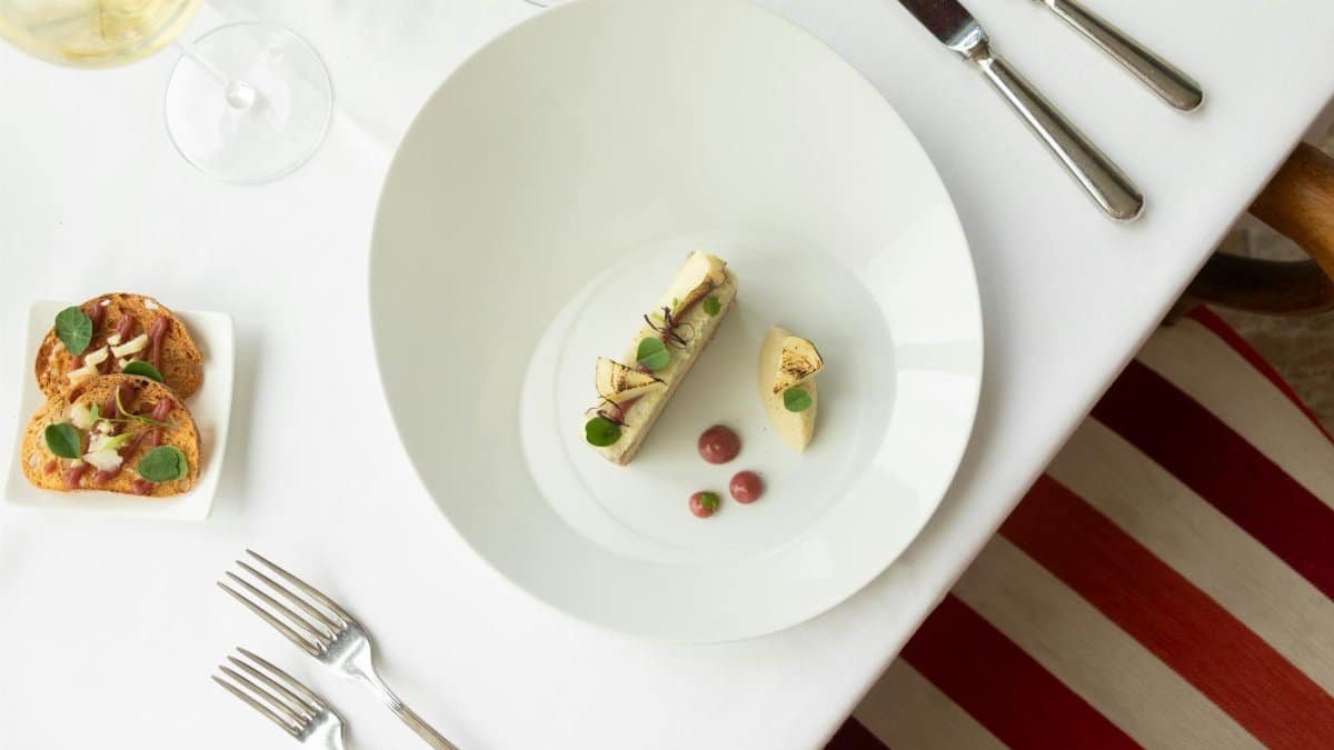 Top view of gourmet French cuisine in a fine dining setup, Vonnas, France.