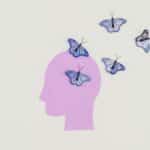 Abstract art of butterflies emerging from a silhouette head representing imagination and freedom.
