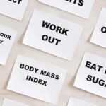 Flat lay of motivational health quotes on paper, promoting healthy habits and self-care.