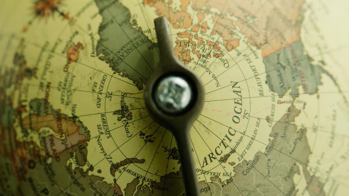 Close-up of a vintage globe highlighting the Arctic Ocean and northern territories.