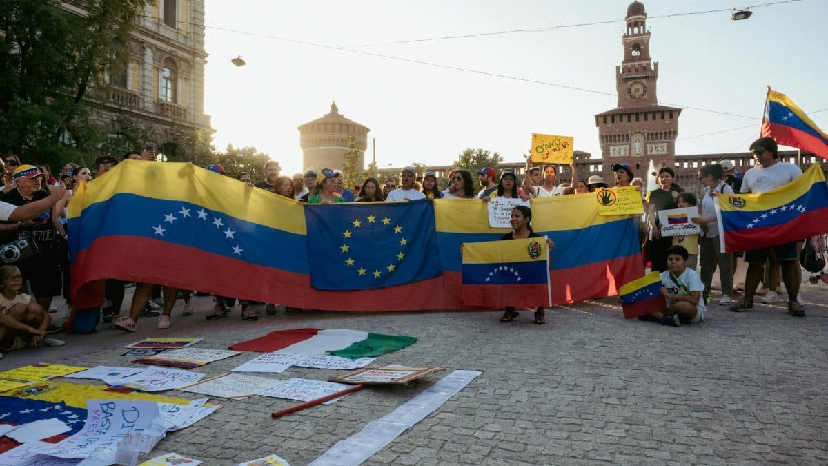 Demonstrators hold Venezuelan flags at a protest in Milan, Italy.