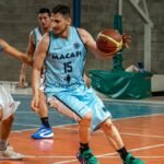 Dynamic shot of basketball players in action during an indoor game.