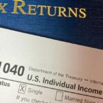 Close-up image of Form 1040 for U.S. tax returns, highlighting filing status options.