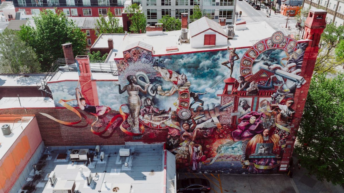 Aerial view of a vibrant mural on a Philadelphia building during the day.