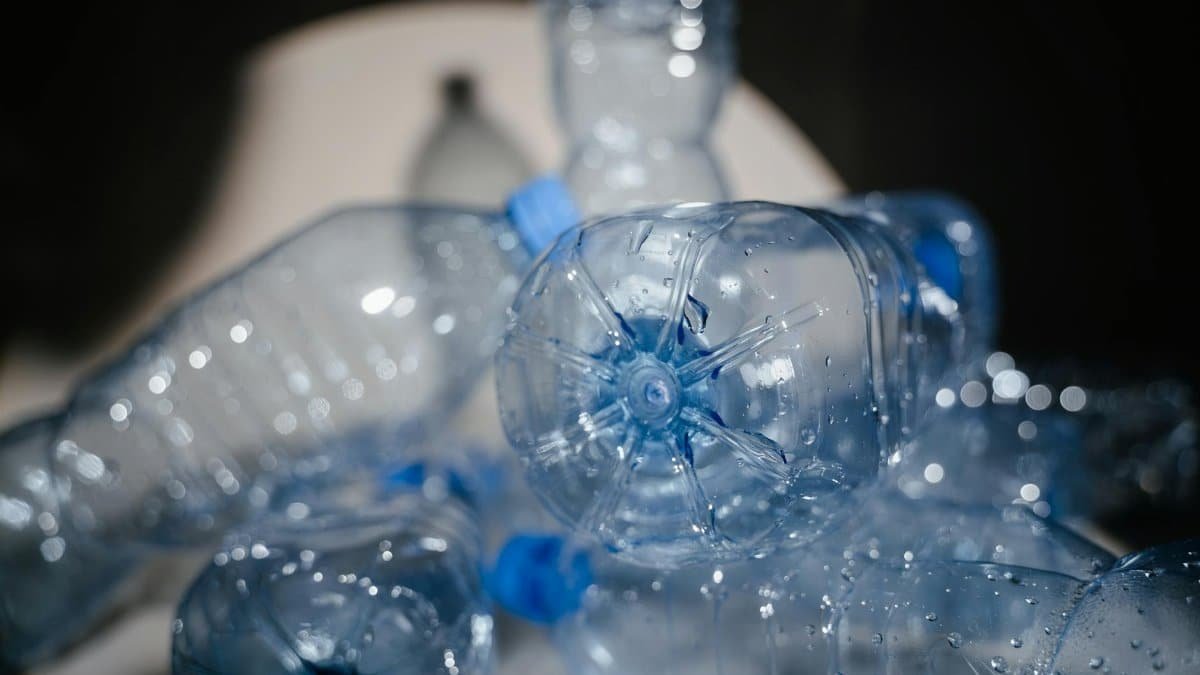 Detailed close-up of used plastic bottles ready for recycling, highlighting environmental impact.