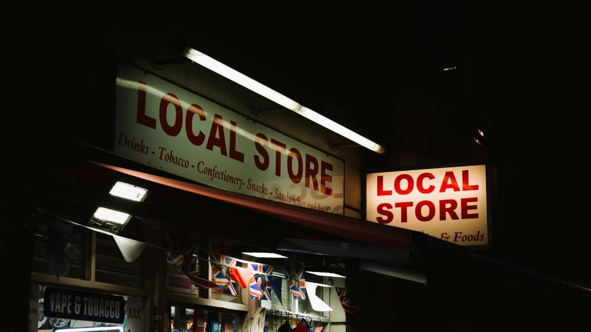 An urban local store glowing with neon signs during nighttime, capturing the essence of city nightlife.