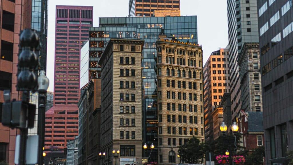 Bustling street scene in downtown Boston, showcasing modern and classic architecture.