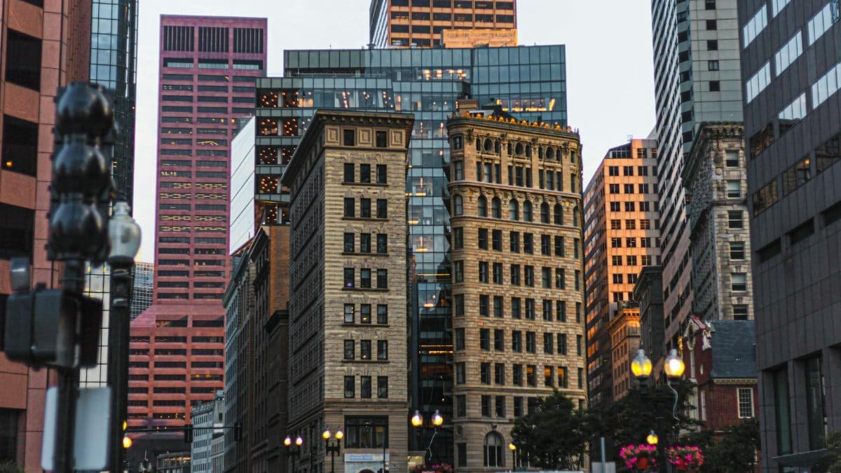 Bustling street scene in downtown Boston, showcasing modern and classic architecture.