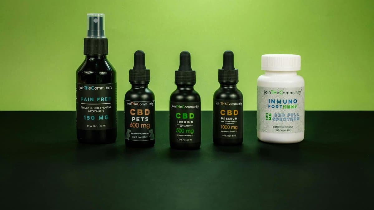 A selection of CBD health products set against a vivid green backdrop representing natural wellness.