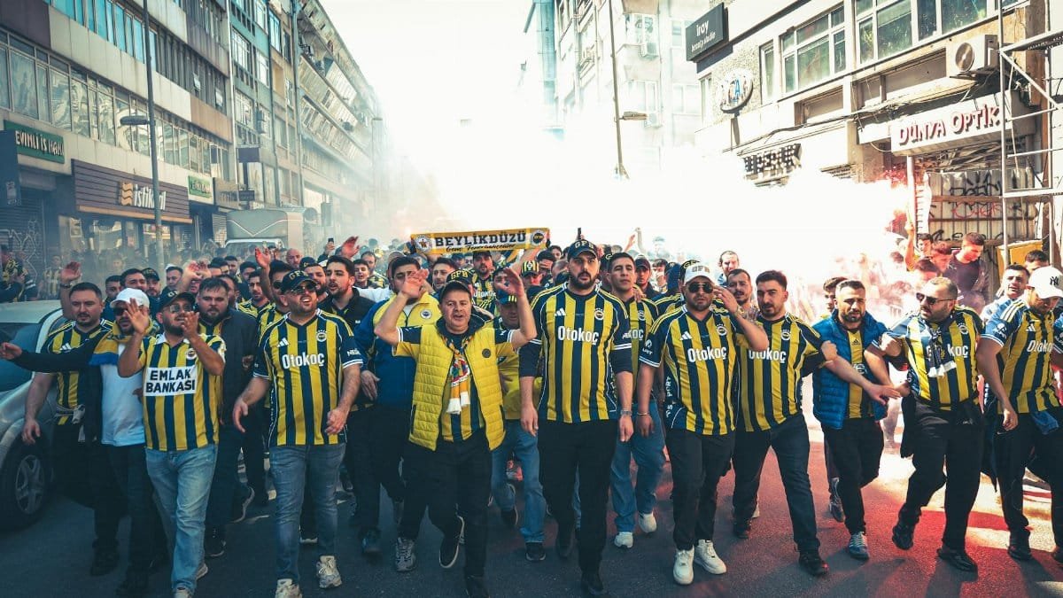 A vibrant group of Fenerbahçe fans rallying in Istanbul, showing sports passion and team spirit.