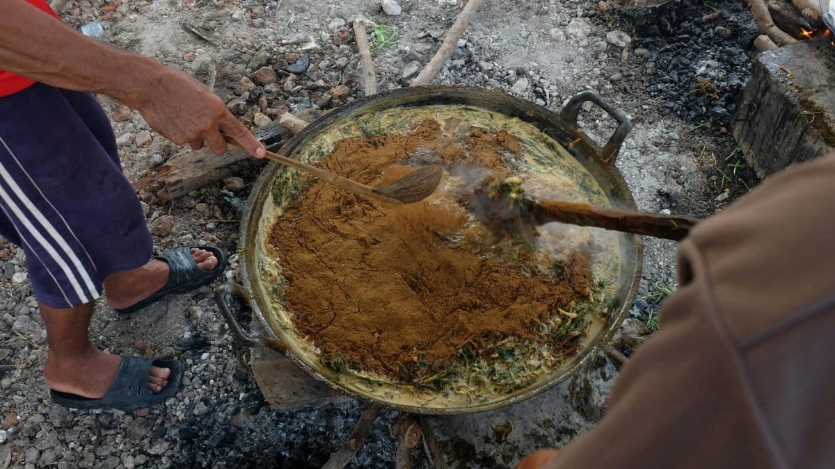 Experience a rustic cooking method in Gresik, Indonesia, capturing local culinary practices and techniques.